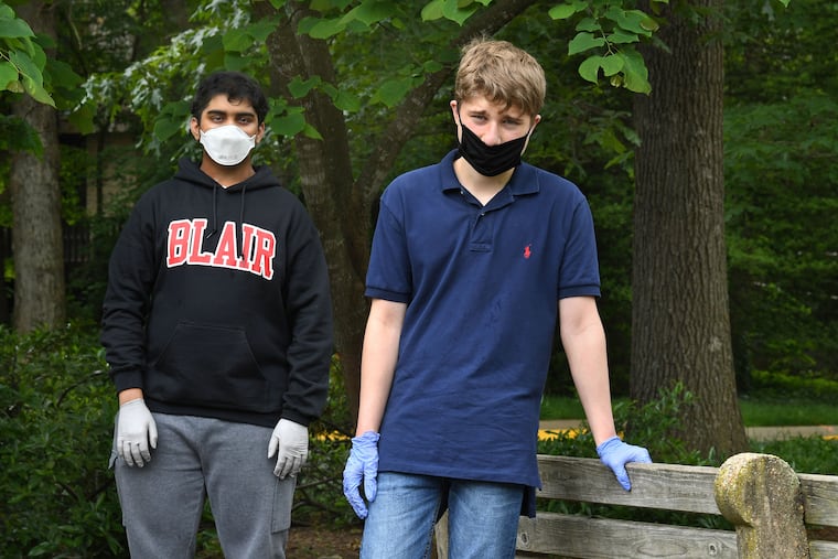 Dhruv Pai, 16, and Matt Casertano, 15, in Potomac, Md., after making their second "no touch" delivery of the day.