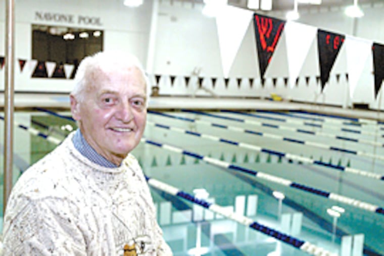 Paul Navone overlooks the pool at St. Augustine Prep School in Richland NJ that is named after him. (Ron Tarver/ Inquirer)