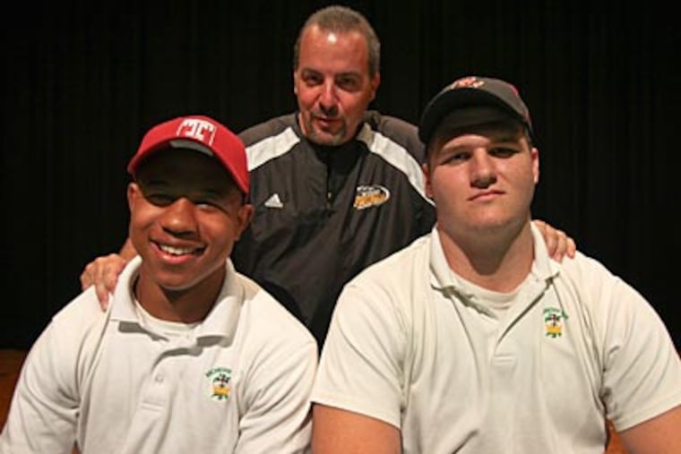 Archbishop Wood coach Steve Devlin poses with Frank Taylor (right) and Brandon Peoples. (Joseph Kaczmarek/For the Daily News)