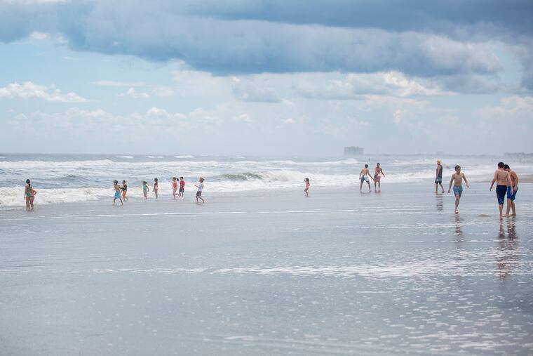 Kids play at the beach and enjoy the weather at Margate City Beach on Saturday. Sunday will be chilly at the Shore.