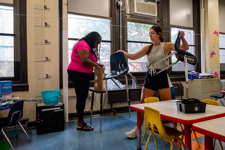 Aliyaah Stibbins (left), a Supportive Services Assistant in the kindergarten class of Francesca Galdo (right) prepare their classroom at Fanny Jackson Coppin Elementary Tuesday, Aug. 18, 2026 ahead of the start of the school year on Aug. 24. Stibbins is going into her 7th year with Galdo who is in her 13th year with the School District of Philadelphia.