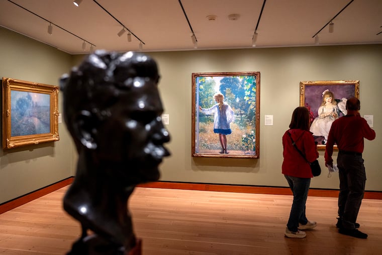 With Daniel Garber's 'Tanis' spotlighted at the center, a room in 'A Nation of Artists' at the Philadelphia Museum of Art.