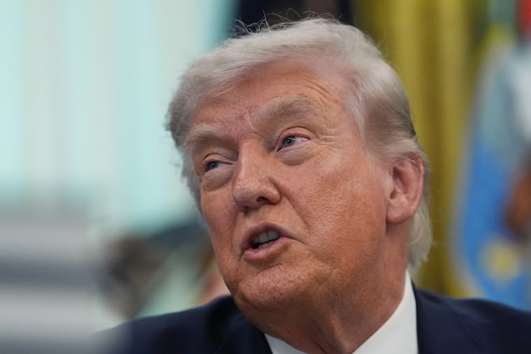 President Donald Trump answers questions from reporters after signing an executive order in the Oval Office of the White House Tuesday, March 31, 2026, in Washington.