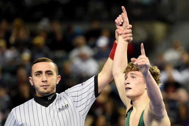 Camden Catholic's Lucas Revano celebrates after defeating Howell's Kyle Slendorn to win just before the buzzer in his the 132-pound final at the 2018 NJSIAA State Wrestling Championships on March 4, 2018.