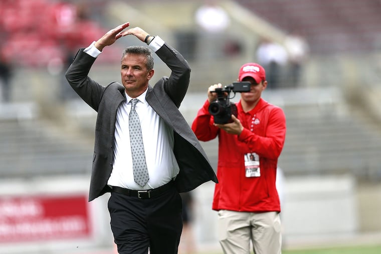 Ohio State head football coach Urban Meyer responds to the crowd with an "O" on his walk into the stadium before a game against Tulane at Ohio Stadium in Columbus, Ohio, on Saturday, Sept. 22, 2018. Ohio State won, 49-6. (Brooke LaValley/Columbus Dispatch/TNS)