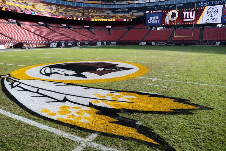 The Washington team logo on FedEx Field prior to a game last year.