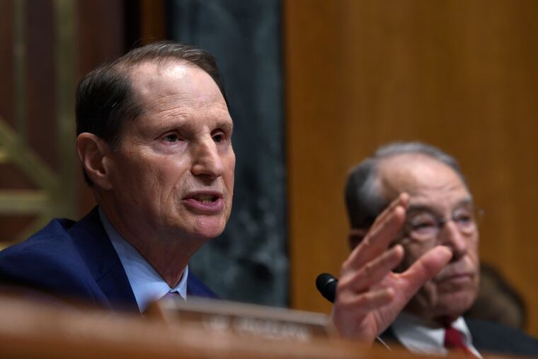 Senate Finance Committee ranking member Sen. Ron Wyden, D-Ore., left, sitting next to Committee Chairman Sen. Chuck Grassley, R-Iowa, right, speaks during a hearing on Capitol Hill in Washington, Tuesday, April 9, 2019, with pharmacy benefit managers that explored the high cost of prescription drugs.