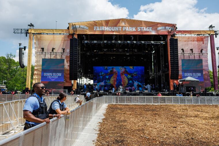 Police officers at the Fairmount Stage as gates open for the first day of the Roots Picnic.
