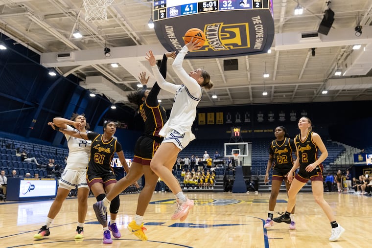 La Salle guard Ashleigh Connor (15) goes up for a shot in Saturday's game against Loyola Chicago. The redshirt junior guard finished with 26 points in the Explorers' win.