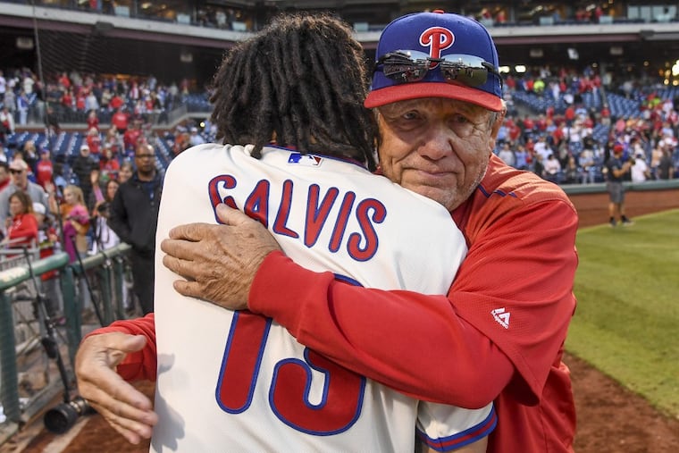Phillies bench coach Larry Bowa (right) hugs shortstop Freddy Galvis a hug after the 2017 season’s final game, Oct 1.