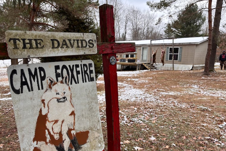 A buck and doe hang from the meat pole outside Camp Foxfire, which the David family of Aliquippa purchased in 1972.