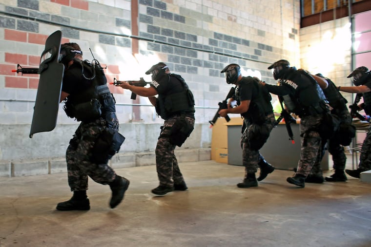 Members of the Chester SWAT team participate in six SWAT-related competitions, including shooting drills and an active-shooter scenario, in a mock school set up at the Emergency Services Training Center.
