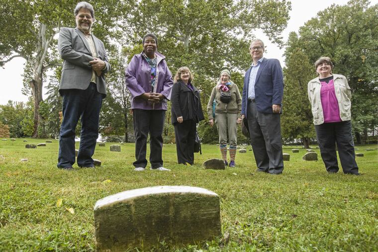 Standing in the area of the Abington Friends cemetery are members of the Friends Meeting in Abington that were responsible for commemorating all of the people buried in their cemetery. From left: Tom Dwyer, Avis Wanda McClinton, Loretta Fox , Rosie Bothwell, ( who donated the plaque) , George Schafer, and Rochelle Tormollen.