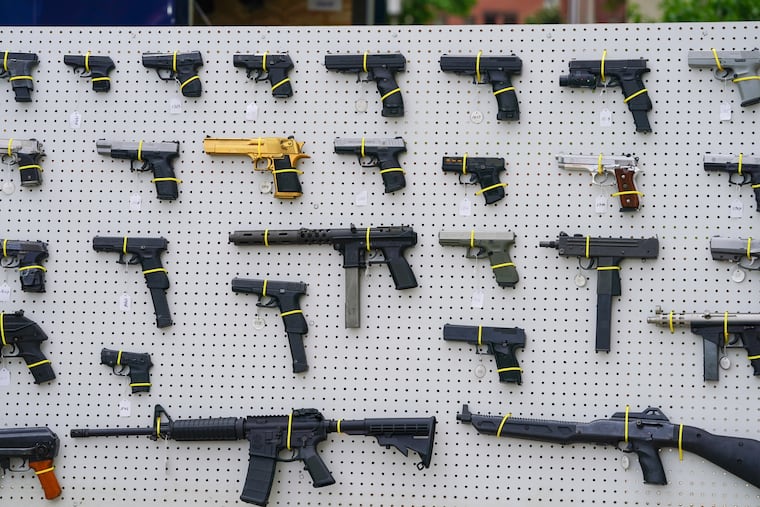 A display of guns on a board at a press conference at the Philadelphia Police Department Office of Forensic Science in May.