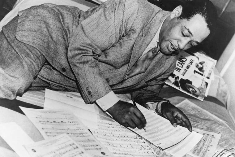 The great D.C.-born jazz bandleader, arranger and composer Duke Ellington with musical scores in an undated photograph. He left behind some 1,500 songs.