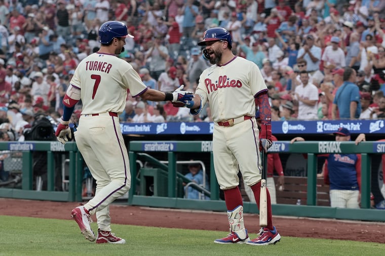 Trea Turner celebrates his fifth inning solo home run with Kyle Schwarber (right) during the Phillies' win on Saturday. Schwarber also hit a homer in the first.