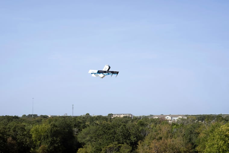 This photo provided by Amazon shows a drone delivering presciption drugs in College Station, Texas. Amazon will soon make prescription drugs fall from the sky when the e-commerce giant becomes the latest company to test drone deliveries for medications.