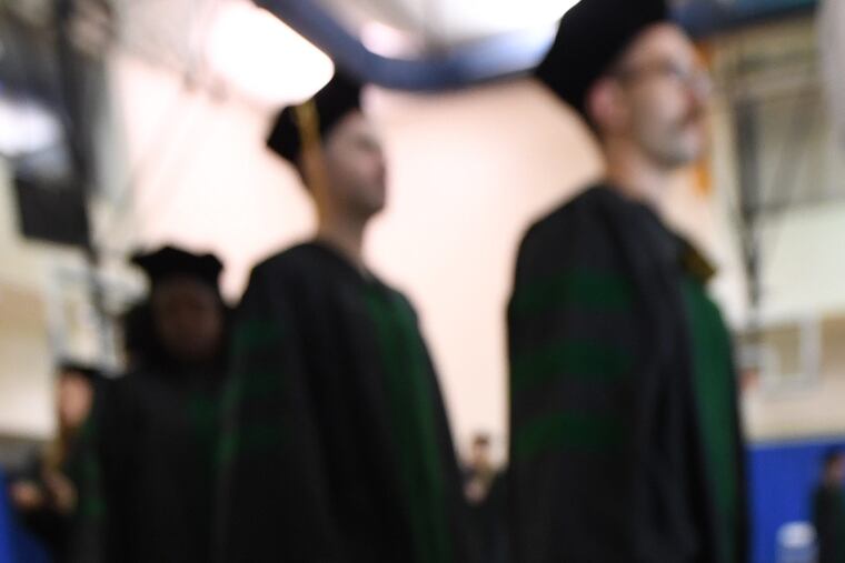 College graduates are facing such steep debt loads that they can not fully participate in the economy. JOSE F. MORENO / Staff Photographer