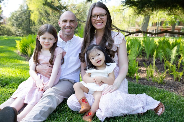 Bill and Laura with daughters Adelynn (left) and Safina.