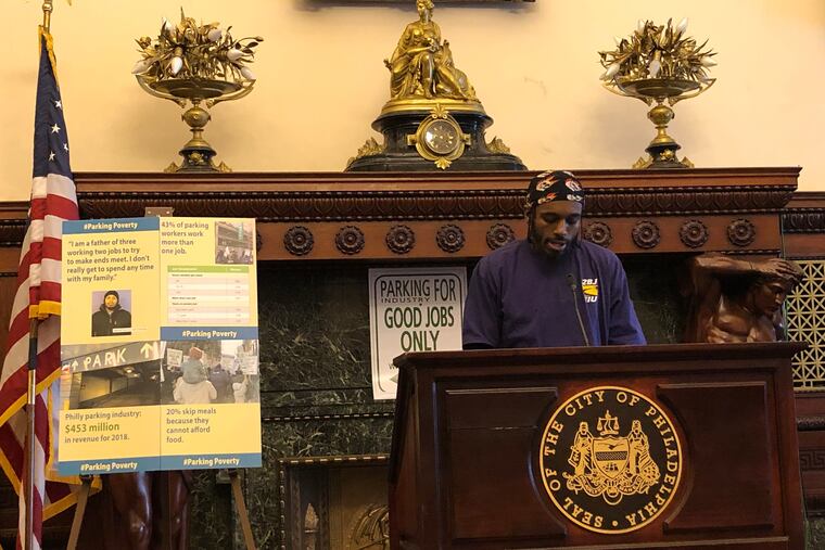 Parking worker Mike Hardaway speaking at news conference last month about low wages.