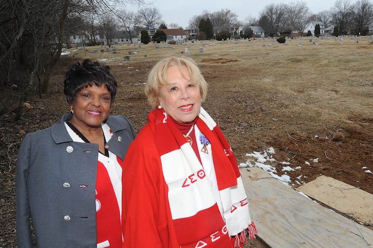 Geraldine Myles (left) and C. Gloria Akers at Pauline Oberdorfer Minor’s grave site. (CLEM MURRAY / Staff Photographer)