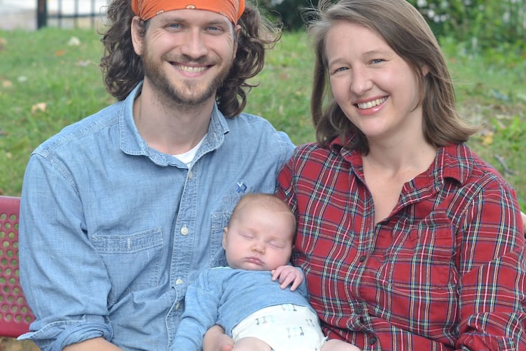 Eric Peterson, Hannah Mayer, and baby Charlotte.