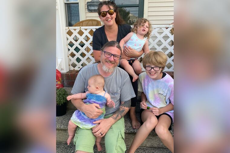 Lindsey and John with kids (from left): Penny, Eliot, and Jamie.