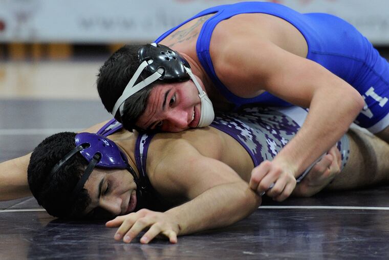Paul VI 170-pounder Jordan Sciamanna (top) wrestles Cherry Hill West's Manny Morales and earns a 9-8 decision on Monday.