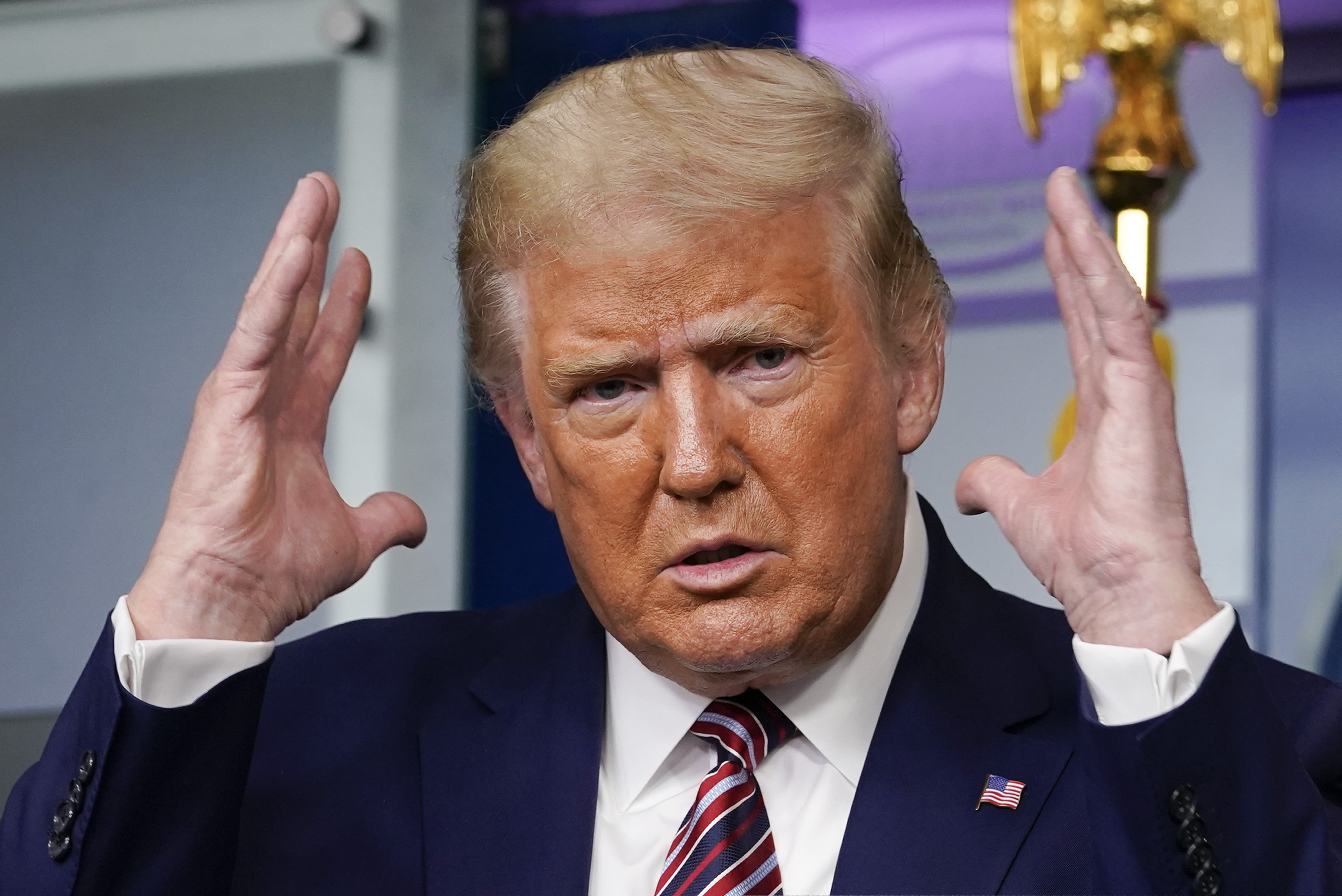 President Donald Trump gestures while speaking during a news conference at the White House, Sunday, Sept. 27, 2020, in Washington.