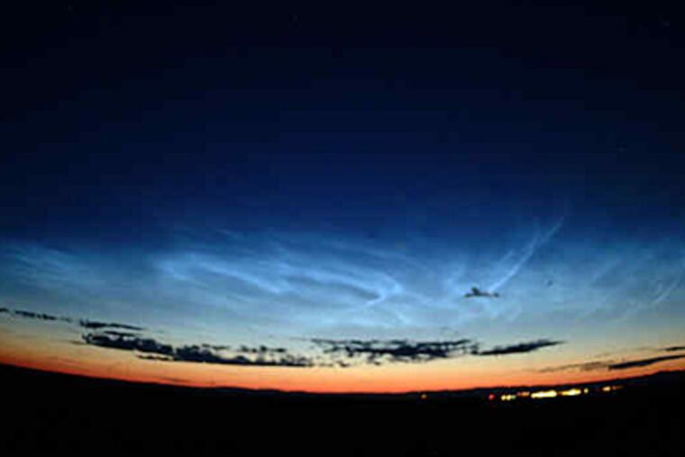 Noctilucent clouds observed from Donnelly Dome near Fairbanks, Alaska, resulting from a post-space shuttle plume in August 2007.