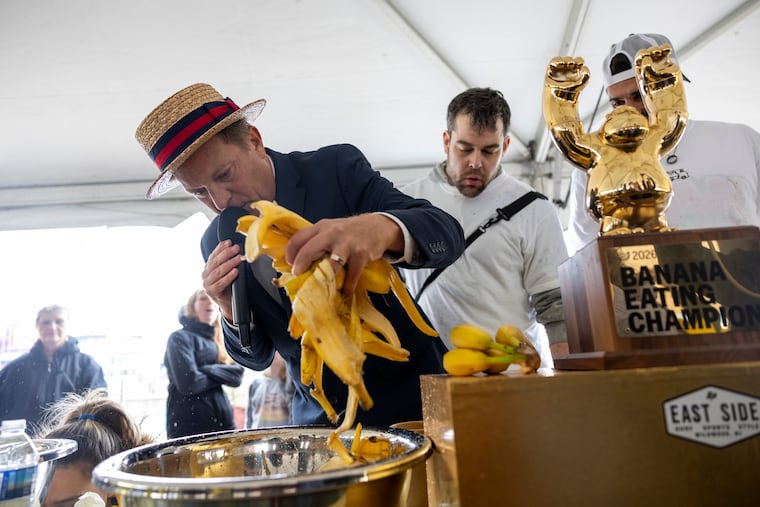 Major League Eating emcee Sam Barclay, checking the winners' bowls to ensure they ate all their bananas at the banana-eating competition at the East Side Surf Shop with Sun Bum in Wildwood, N.J., on Saturday, May 23, 2026.