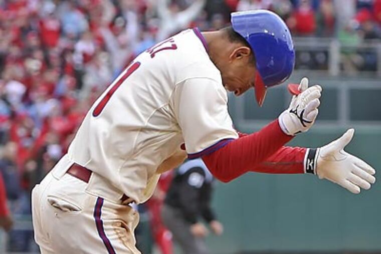 Wilson Valdez claps after driving in the game-tying run in the ninth inning against the Astros. (Steven M. Falk/Staff Photographer)