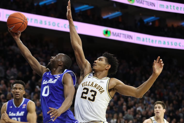 Quincy McKnight of Seton Hall going up for a shot against Jermaine Samuels of Villanova on Saturday.
