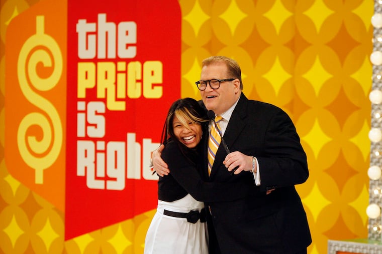 Show #4252K of THE PRICE IS RIGHT. Drew Carey with contestant Carmie Fortunato. Photo: Mark Davis/CBS ©2008 CBS Broadcasting Inc. All Rights Reserved.