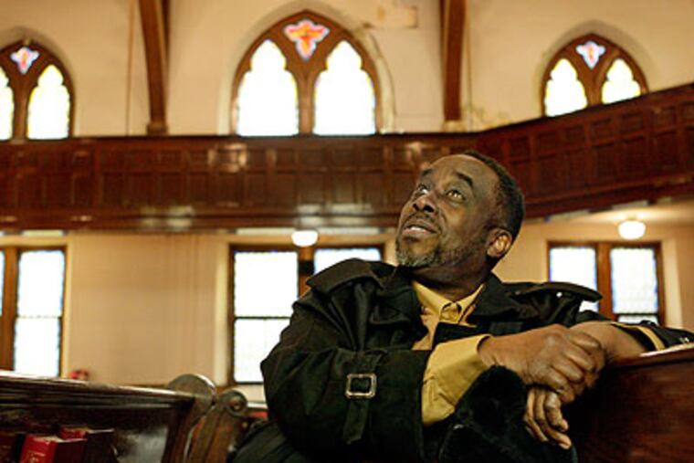 <b>Where it all began:</b> Philly jazz violinist John Blake Jr. looks around Holy Trinity Baptist Church at 18th and Bainbridge, where as a boy he listened to his mother play the organ. (Elizabeth Robertson / Staff Photographer)
