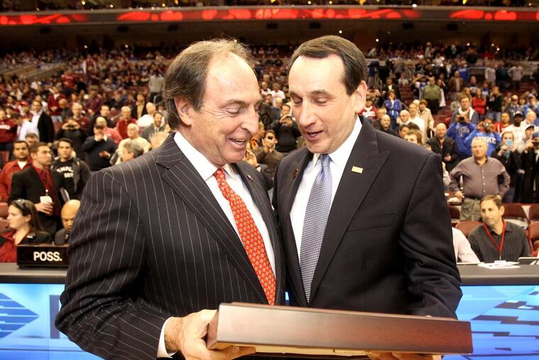 Temple Head Coach Fran Dunphy, left, presents Duke's Head Coach Mike Krzyzewski with an award recognizing his achievements prior to the start of the game. Duke visits Temple University at a game played at the Wells Fargo Center. Wed Jan 04 2012