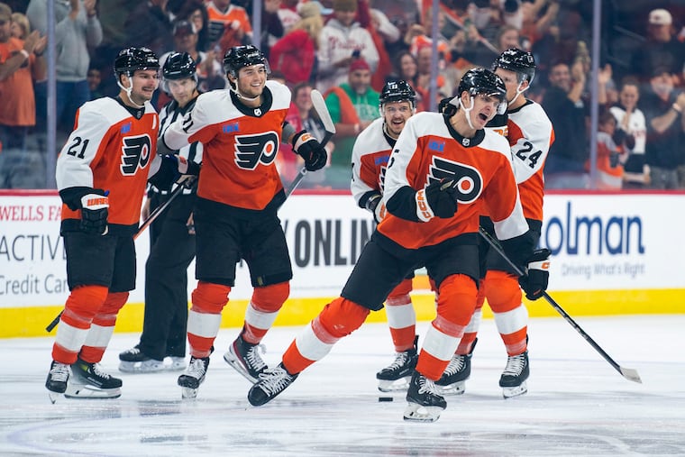 Egor Zamula, second from right, reacts to his goal on Tuesday against Vancouver.