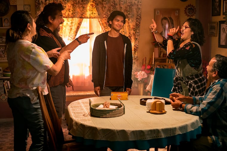 In this image released by Warner Bros. Pictures, (from left) Elipidia Carrillo, George Lopez, Xolo Maridueña, Belissa Escobedo, and Damián Alcázar in a scene from "Blue Beetle."