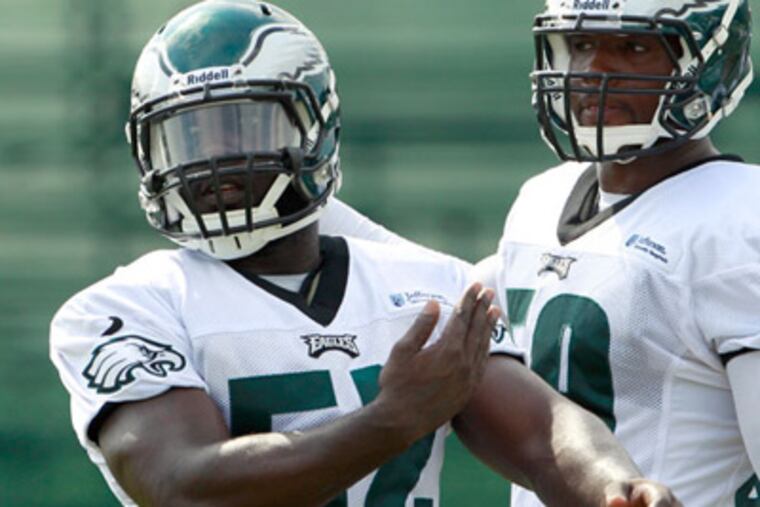 Brian Rolle, left, has lost his starting job to Akeem Jordan. (Yong Kim/Staff Photographer)