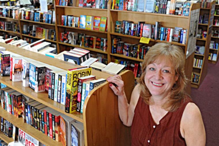 Owner Kathy Simoneaux says she’s considering options including a smaller location just for books. She and her husband opened the store in 1982, but it now faces stiff competition from e-books and online sales. CLEM MURRAY / Staff Photographer