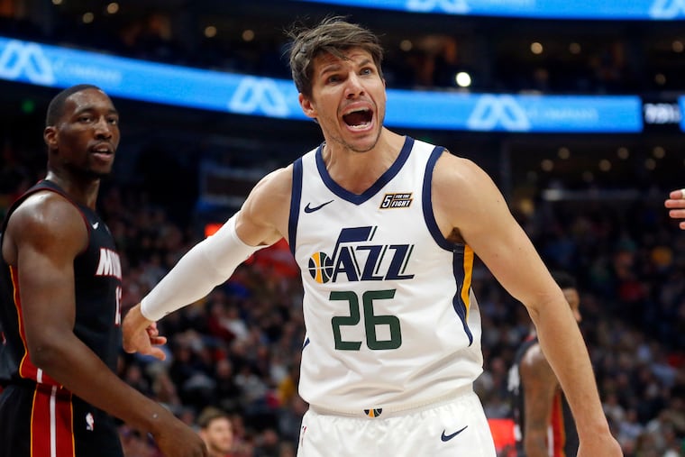Utah Jazz guard Kyle Korver (26) shouts to an official as Miami Heat center Bam Adebayo, left, looks on in the first half of an NBA basketball game, Wednesday Dec. 12, 2018, in Salt Lake City.