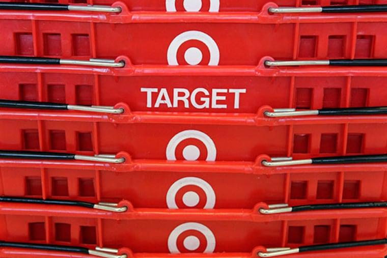Shopping baskets are stacked at a Chicago area Target store. (AP Photo/Charles Rex Arbogast, File)