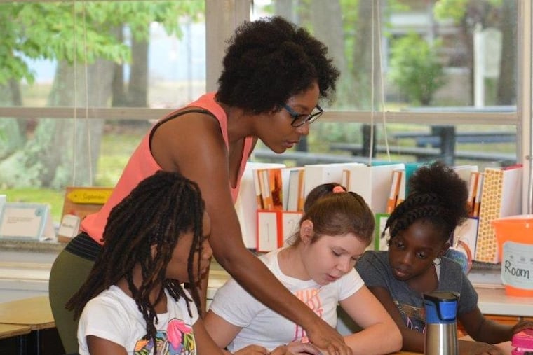 Burlington County teacher of the year Sherrie Wilkins at work. A study finds that segregation remains stubborn in New Jersey schools.