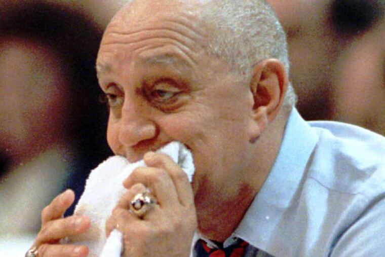 Jerry Tarkanian in a familar pose: Chewing on a towel on the sideline. He said he started the ritual during long practices when he could not stop to get some water.