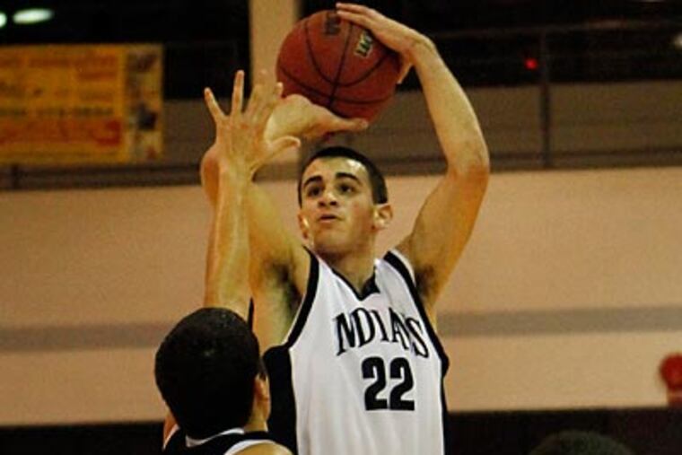 Council Rock North's Arron Goodman takes a shot over St. Joe's Prep defender Mike Fee in the second quarter. (Laurence Kesterson/Staff Photographer)