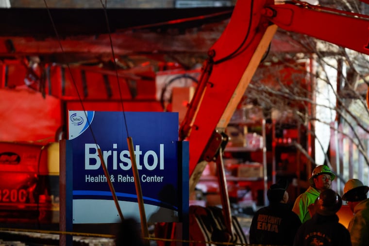 First responders work the scene of an explosion and fire at Bristol Health and Rehab Center, on Tuesday, Dec. 23, 2025, in Bristol, Pa.