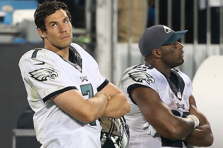 Sam Bradford (left) and DeMarco Murray watch late in the 4th quarter.