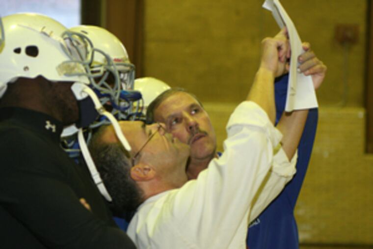"West Catholic was the glue to our neighborhood," says Tom DeFelice (rear), shown with assistant Frank "Roscoe" Natale.