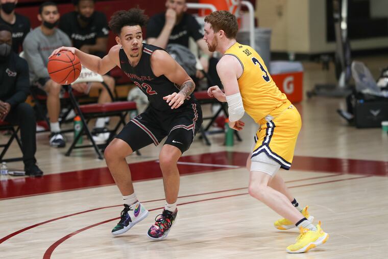 St. Joe’s guard Jordan Hall with the ball last season against La Salle.