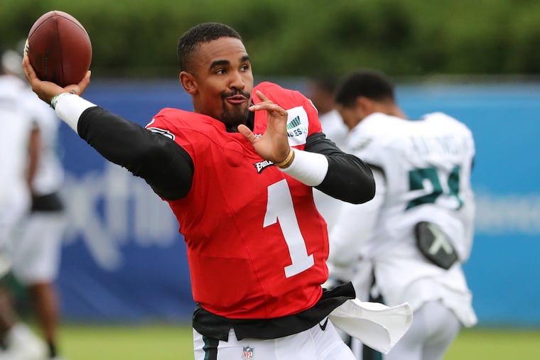 Eagles quarterback Jalen Hurts (1) throws the ball before the start of training camp at the NovaCare Complex on Aug. 4.